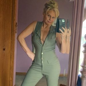 Army green jumpsuit with red strapped platforms